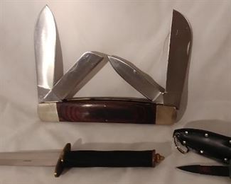 12. Dagger Knife with Cloth Wrapped Handle Asking $55.00 (left), Large Pocket Knife Solingen Steel Asking $75.00 (back), Small Dagger Knife with Sheath Asking $25.00 (right)