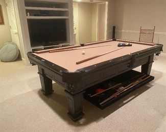Ozone Billiards black traditional style pool table with Presidential 1” thick slate. Features leather pockets, pull-out storage, and tan felt covering. All accessories included. In impeccable condition.