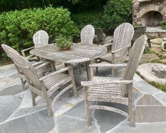 Kingsley Bates outdoor teak dining set featuring 72” oval table with 2” umbrella hole & six Hampton chairs (retired design)