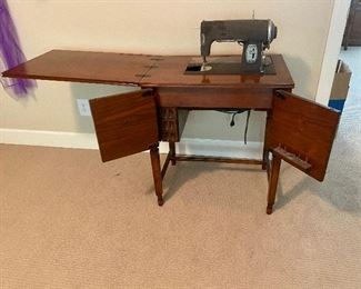 Vintage (nearly antique) Kenmore Deluxe Rotary Electric sewing machine (model E6354) & Integrated cabinet. Circa 1938.
