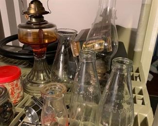 Vintage milk bottles, vintage kerosene lamp