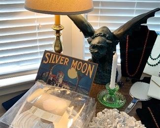 Brass lamp $12
Gargoyle $28
Green depression glass candle holder $10
Plaster bird feeder $6
Silver moon sign $10
Paper lantern $4