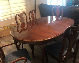 Formal cherry wood dining set with 6 newly  Reupholstered chairs, 2 leafs plus pad coverings for entire table
