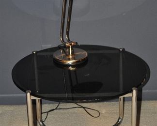 FABULOUS SMOLE GLASS TOP WITH CHROME BASE SIDE TABLE, 27” ROUND X 20” H. OUR PRICE $265.00