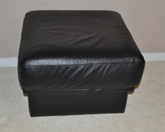 BLACK LEATHER OTTOMAN ON CASTERS, MADE IN ITALY, 25"W X 25"D X 16"H. OUR PRICE $165.00