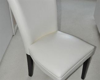 WHITE FAUX LEATHER PARSON CHAIR BY STEVE SILVER. OUR PRICE $75.00