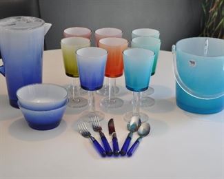 SET OF 12 ACRYLIC PATIO SET INCLUDES 8 FOOTED GLASSES, 2 BOWLS, PITCHER AND ICE BUCKET, OUR PRICE $60.00. ALSO SHOWN IS A 5 PIECE SERVICE FOR 12 BLUE VINTAGE ACRYLIC OUTDOOR FLATWARE SET. OUR PRICE $80.00