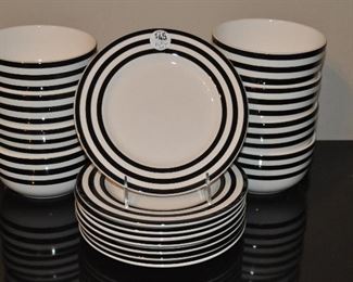 8 BOWLS AND 8 PLATES SET BY A STEP BEYOND. OUR PRICE $45.00