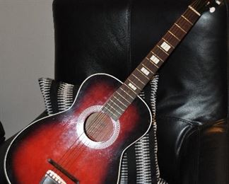 VINTAGE BLACK AND ROSE ACOUSTIC GUITAR, MADE IN USA. OUR PRICE $175.00