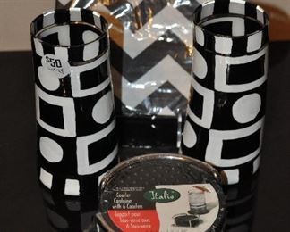 A PAIR OF 6.25" HAND PAINTED FANTASTIC GLASS TUMBLERS, NEW WATER PROOF COASTER SET AND ZIGZAG NAPKINS. SOLD AS A SET FOR $50.00