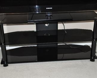 FANTASTIC HEAVY THREE TIER BLACK TEMPERED GLASS MEDIA  UNIT WITH BLACK GLOSS ROUND DIVIDERS, 50"W X 18"D X 23"H. OUR PRICE $225.00