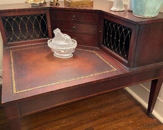 Leather top corner table with drawers.