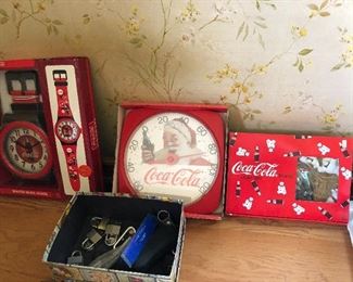 more new in box Coke clocks and thermometers