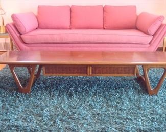 Living Room:  The Mid-Century Modern LANE coffee table is part of the "Perception" line with sculptural boomerang legs.  It measures 70" wide x 18" deep x 13" tall and has one drawer, as shown.