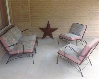 Patio: The four-piece Mid-Century Modern patio furniture needs a little TLC but is still very usable and desirable. There are actually four separate chairs (three have arms) that can be configured in different ways. The rusty star is also for sale.