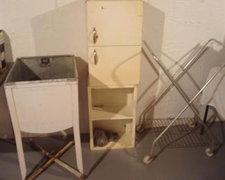 Basement:  A vintage wash tub; two stacked metal cabinets, and a rolling rack are all for sale.