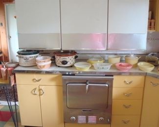 Kitchen: A closer view of newer crock pots and vintage dishes (including Fire King and Pyrex).