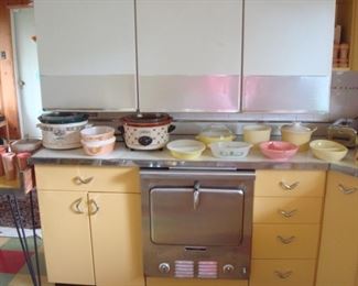 Kitchen:  A closer view of newer crock pots and vintage dishes (including Fire King and Pyrex). 