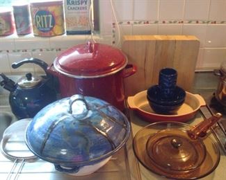 Kitchen: Yes, more! Including a red PAULA DEEN stock pot; a LeCreuset oval pan; vintage VISIONS cookware; and a large pottery bowl/lid.