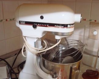 Kitchen:  This is a closer view of the vintage KITCHEN-AID mixer which includes the stainless bowl, shield, and various attachments.  It has 350 watts.