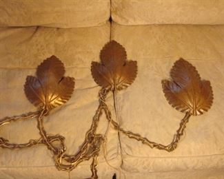 Bedroom:  This is a unique Mid-Century Modern hanging light fixture.  Each leaf gets independently attached to the wall.  (A light bulb is behind each leaf.)  You can hang it in a straight line or angled line before you attached the ceiling chain and plug it in!