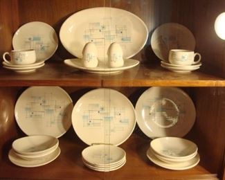 Dining Area:  The 1950's FRANCISCAN "Atomic Oasis" china includes:  one platter, four dinner plates, four salad plates, four dessert plates, four cereal bowls, two cups, four saucers, and a set of salt & pepper shakers.   It is priced out (not priced as a set).