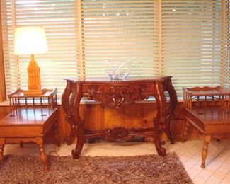 Family Room:  A pair of hard rock maple side tables with hinged top drawers and a vintage lamp flank a carved wood console table and punch bowl set.  The side tables are priced as a pair but there is also a matching coffee table coming up.  A closer photo of the carved wood table follows. 