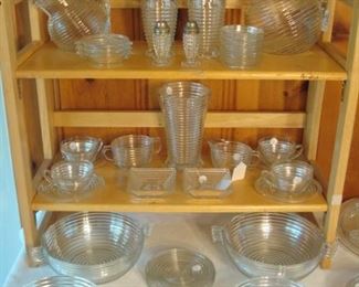 Family Room: The ribbed "Manhattan" glass includes: water and juice pitchers; tumblers; salt & pepper set; cups & saucers; cream & sugar; winged bowls; ashtrays; candle holders and more! Each piece is priced OR priced as a set (e.g., set of coasters; per bowl; per dinner plates) so you can complete your current collection without having to purchase multiples.
