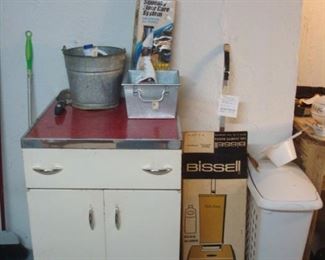 Lower Level:  A vintage metal cabinet and other miscellaneous items are all for sale.