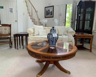 Rosewood Coffee Table with Etched Motif and Golden Feet (front); Bosch-Delfts Ming Jar; Off-White Floral Loveseat (back); Rosewood End Table with Etched Motif
