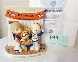 PMB-1 ($40) Precious Moments meets the Denver Broncos in the cute "Together we are a winning team".  Comes with COA and original styrofoam.  