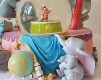 SG-11 ($140) Disney Snow globe/Music Box  "The Carousel Waltz"  plays on this Dumbo Circus Ring.  Measures 10"tall x 10"w