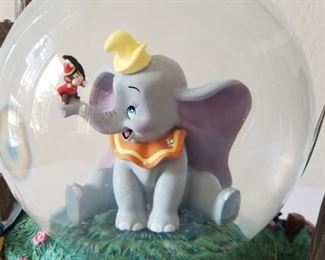 SG-11 ($140) Disney Snow globe/Music Box  "The Carousel Waltz"  plays on this Dumbo Circus Ring.  Measures 10"tall x 10"w