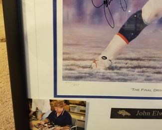 SB-1 ($150) "The Final Drive" John Elway signed this limited edition art piece done by Andy Goralski.  LE #247/507. Includes the COA plus a photo of John signing it.  Comes framed and measures 26.5" x 37.5". 
