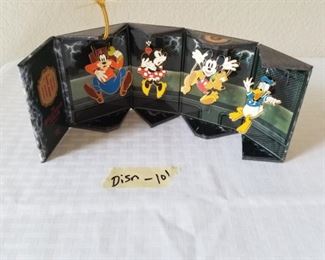 DISN-101 ($25) 2005 Twilight Tower of Terror attraction collection. Only 500 made.  A small box unfolds to reveal 4 collector pins of a scared Donald, Goofy, Mickey and Minnie.  Measures 4" tall. 