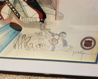 AVB-6 ($100) Patrick Roy Cel by Artist David Martinez. Drawings plus another layer in color.  Signed by both the artist and Patrick (see photo of him signing).  Comes with COA.  The art piece has been named "Roy Persona" and is a limited edition of 23/250.  Comes framed. Measures 19.5" x 16.5"
