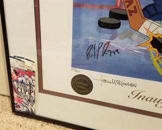 AVB-3 ($100) Taz as an Avalanche Goalie in this limited edition litho-serigraph signed by Patrick Roy, Stephane Fiset (artist) and the McKimson Bros from Looney Tunes.  Comes framed and with the COA.  Limited Edition #231/250.  Measures  28" x 24.5"