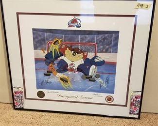 AVB-3 ($100) Taz as an Avalanche Goalie in this limited edition litho-serigraph signed by Patrick Roy, Stephane Fiset (artist) and the McKimson Bros from Looney Tunes.  Comes framed and with the COA.  Limited Edition #231/250.  Measures  28" x 24.5"