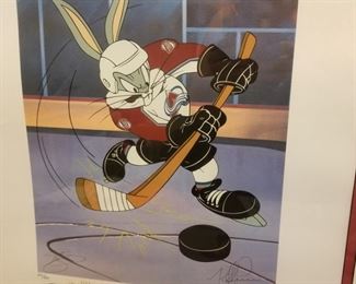 AVB-2 ($100) Signed Looney Tunes Avalanche work of art.  Bugs as an Avalanche player in this mixed media of Lithography and serigraphy.  Signed by both of the Mckimson Brothers from WB Looney Tunes.  PLUS, signed by Joe Sakic and Mike Ricci with photos of them signing this.  Comes with COA on the back.  1996 Stanley Cup.  Comes framed, measures 24" x 28".