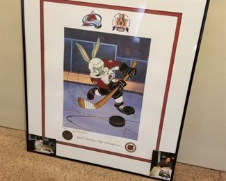 AVB-2 ($100) Signed Looney Tunes Avalanche work of art.  Bugs as an Avalanche player in this mixed media of Lithography and serigraphy.  Signed by both of the Mckimson Brothers from WB Looney Tunes.  PLUS, signed by Joe Sakic and Mike Ricci with photos of them signing this.  Comes with COA on the back.  1996 Stanley Cup.  Comes framed, measures 24" x 28".