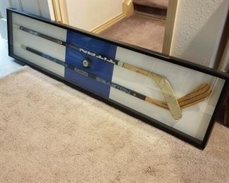 AVB-1 ($65) 2 framed hockey sticks and a puck signed by Peter Forsberg (only the puck is signed).  This shadow frame measures 73.5"L x 18"h.  