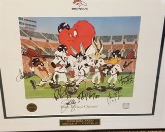 DC-7 ($100) Looney Tunes Cel with Denver Broncos for Superbowl XXXIII (Denver/Atlanta) Limited edition of 500.   Signed by many players including Terrell Davis (pic of him signing on back).  Comes framed and with COA.  Measures 27.5" x 24.5"h.