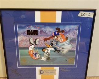 DC-6 ($60) "The Dynamic Duo" Denver Broncos.  Signed by Steve Atwater '27.  This is a limited edition cel signed by artist Charles Mckimson from Looney Tunes.  This is #17/125.  Comes with COA.  Comes framed, measures 18" x 16.5" total.  