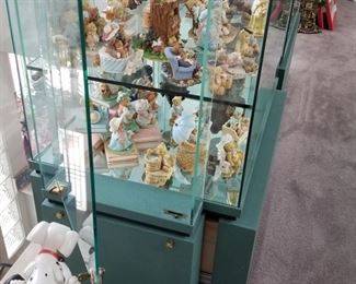 WALT DISNEY shelf display units!  3 available.  All the same size 38"w x 23"d x 80"h.  Each has a key to lock your treasures.  Side door entry on both sides.  Locking drawer at the base.  Official Disney logo at the top.  These are a pale green in color.  Clear glass front and back.  We have 3 available, $600 each.  No flaws noted.