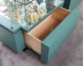 WALT DISNEY shelf display units!  3 available.  All the same size 38"w x 23"d x 80"h.  Each has a key to lock your treasures.  Side door entry on both sides.  Locking drawer at the base.  Official Disney logo at the top.  These are a pale green in color.  Clear glass front and back.  We have 3 available, $600 each.  No flaws noted.