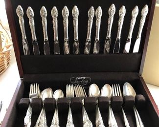 12 Pc Place Setting of Sterling Silver.  Westmorland "Enchanting Orchid" patter.  63 pcs in all.  Service for 12 plus a serving fork and two serving spoons.  Comes in original mahogany box.  ($1100)