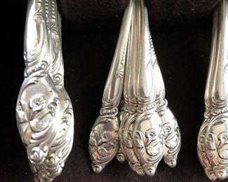 12 Pc Place Setting of Sterling Silver.  Westmorland "Enchanting Orchid" patter.  63 pcs in all.  Service for 12 plus a serving fork and two serving spoons.  Comes in original mahogany box.  ($1100)