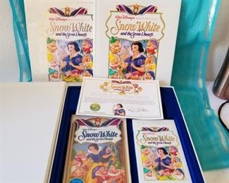 SW7-2 ($30) Deluxe Limited Edition Snow White and the seven Dwarfs gift set.  2 collector VHS movies, set of lithographs to frame and the book.  Open box, but in like new condition.