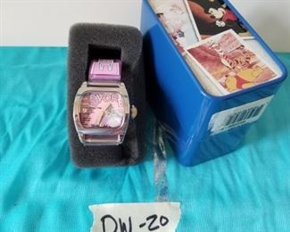 DW-20 ($30) Disney Eeyore watch (new in box).  Clear rubber adjustable band. In Disney tin. 