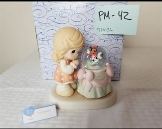 PM-42 ($47) Precious Moments 710036 "Aren't you Sweet".  Shows Minnie Mouse in a snow globe on ice skates.  Comes in original box.  No flaws noted.